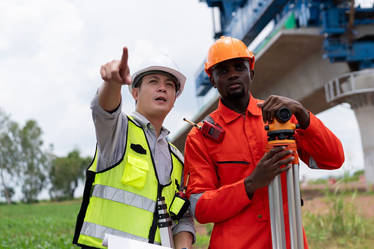 surveyors-and-engineers-use-a-theodolite-and-plans-N3ZACH9.jpg